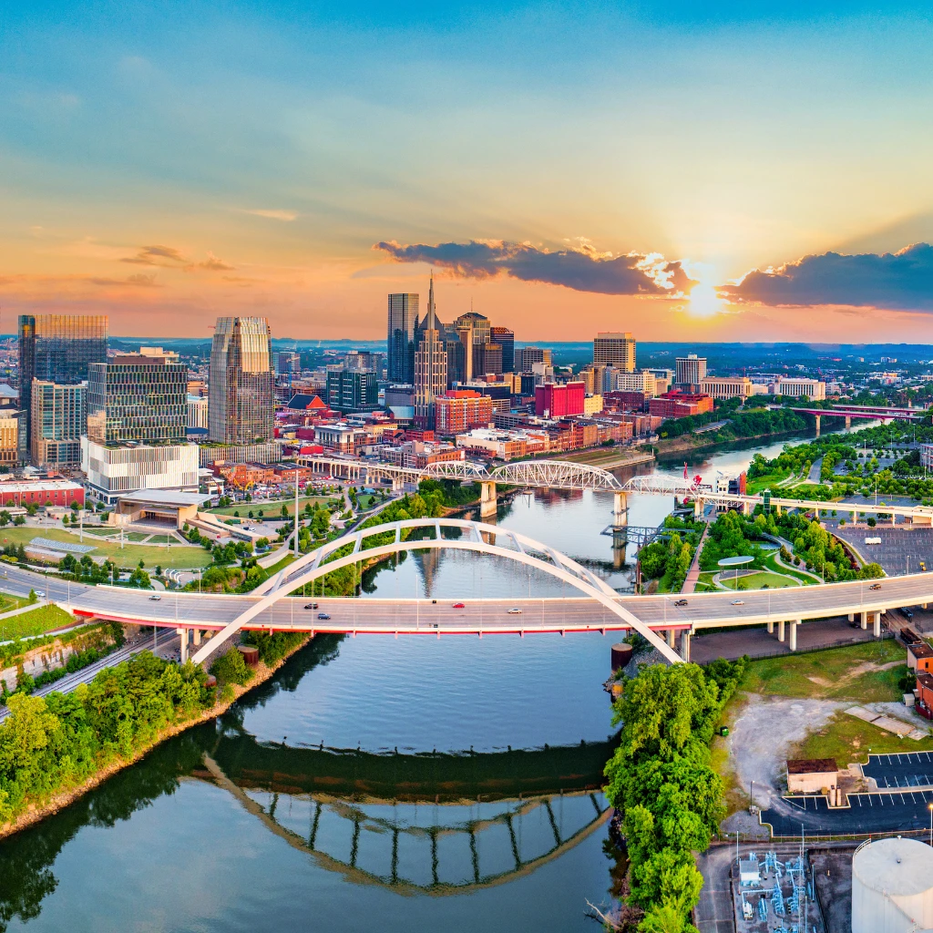 Nashville skyline and the Korean Veterans Bridge over the Cumberland River at sunset, USA