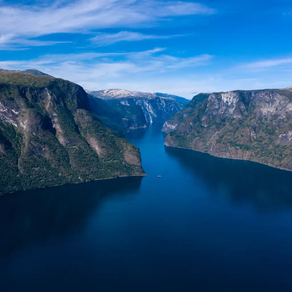 Aurlandsfjord Norway dramatic fjord with steep cliffs and deep blue waters from Flåm Railway