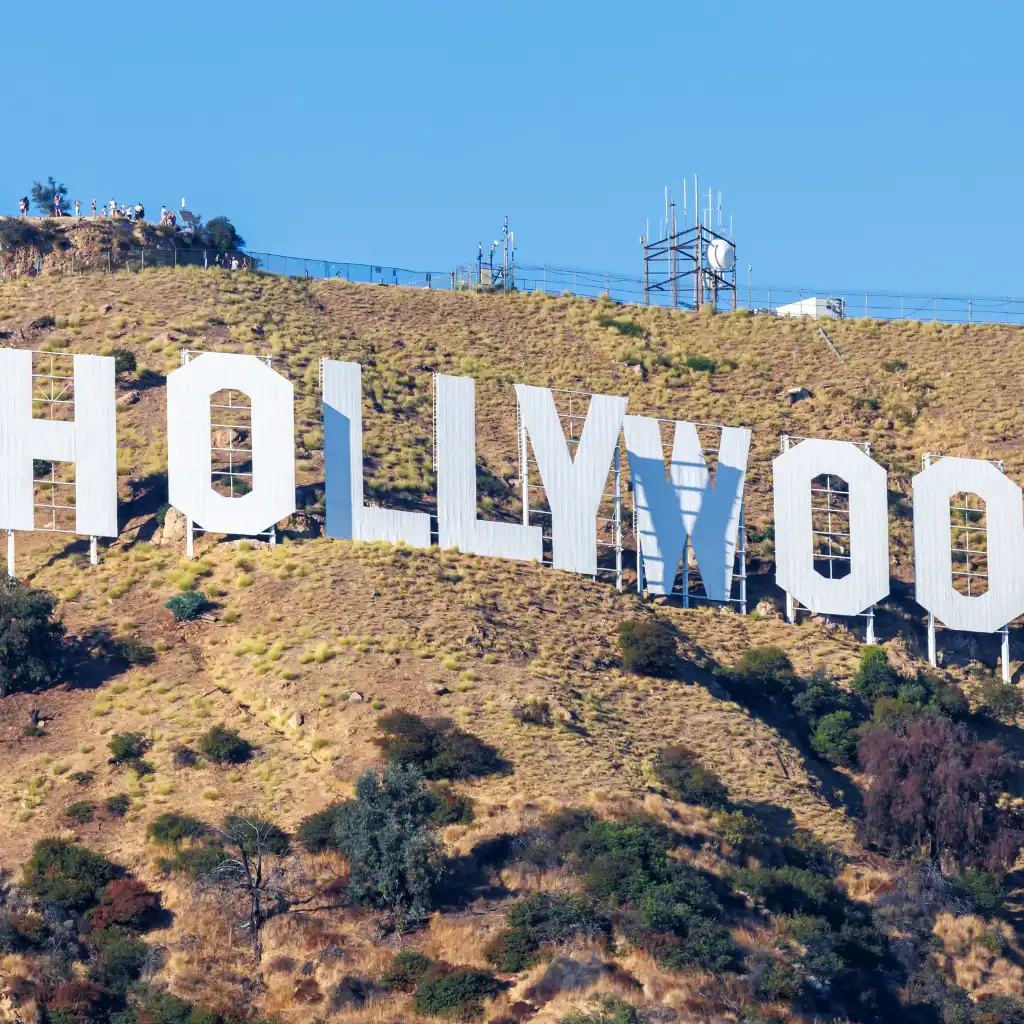 Hollywood Sign on a sunny hillside overlooking Los Angeles, California