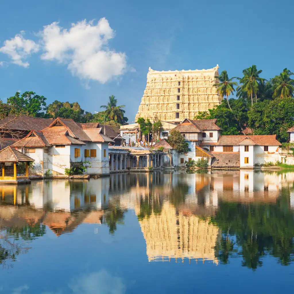 Padmanabhaswamy Temple Trivandrum reflected in calm waters with Kerala architecture and palm trees