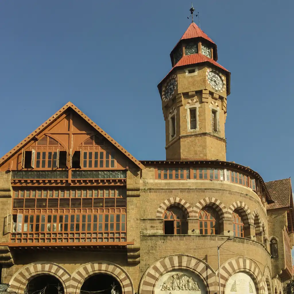 Crawford Market Mumbai clock tower with red roof and ornate arched facade