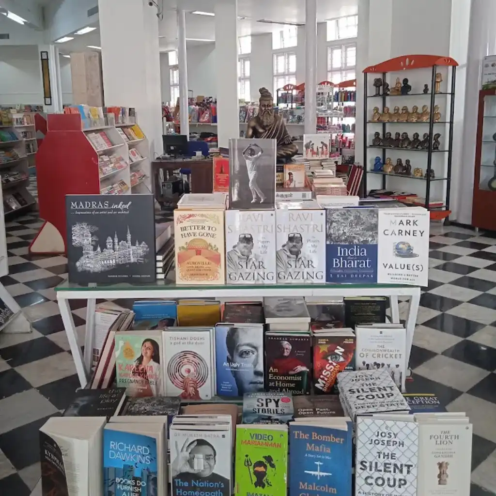 Higginbothams on Mount Road, Chennai bookstore with books displayed on tables and shelves inside the historic store