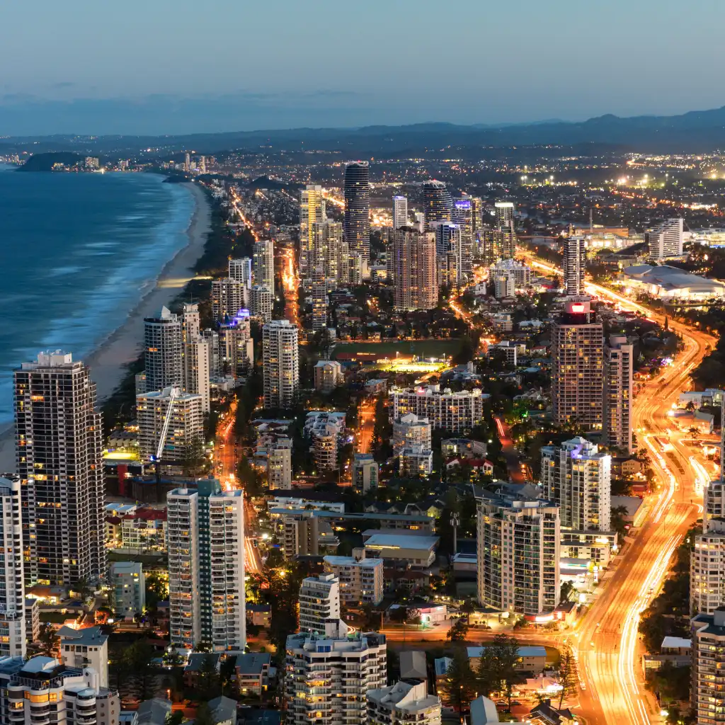 Southern Gold Coast skyline at night looking towards Broadbeach with illuminated skyscrapers and beach lights