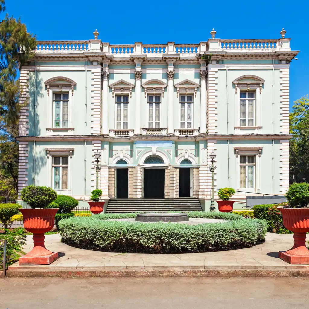 Dr. Bhau Daji Lad Museum Mumbai elegant facade with manicured garden and red planters