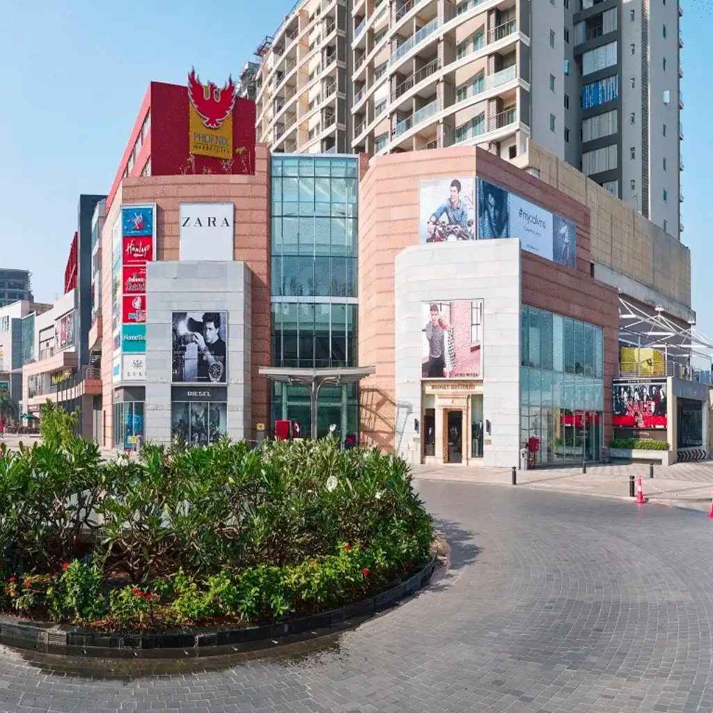 Phoenix Marketcity Chennai mall exterior, curved driveway and greenery