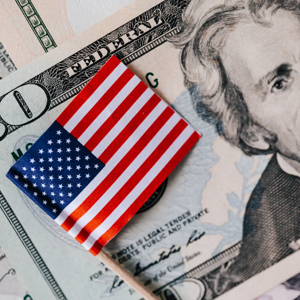 USA trip cost with American flag on dollar bills for Florida road trip budget