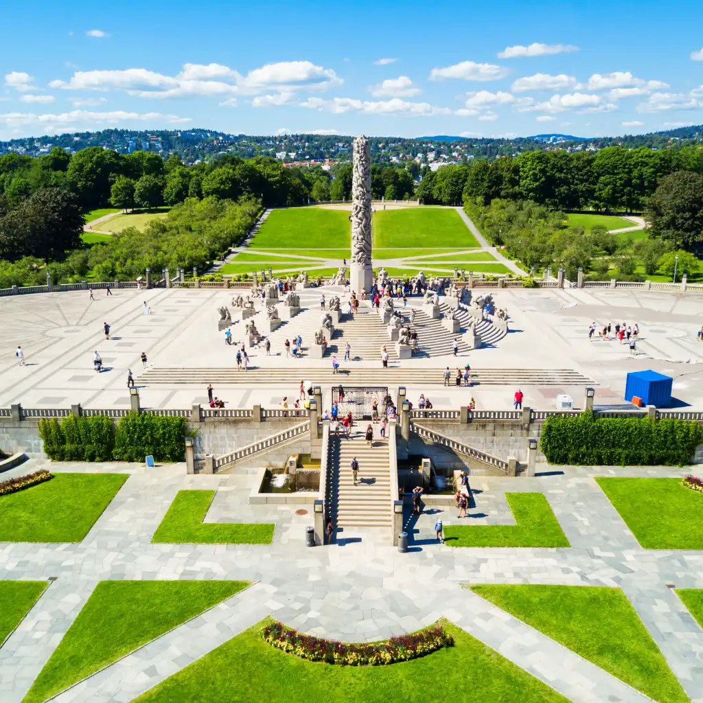Vigeland Sculpture Park Norway Monolith and statues with visitors on sunny day