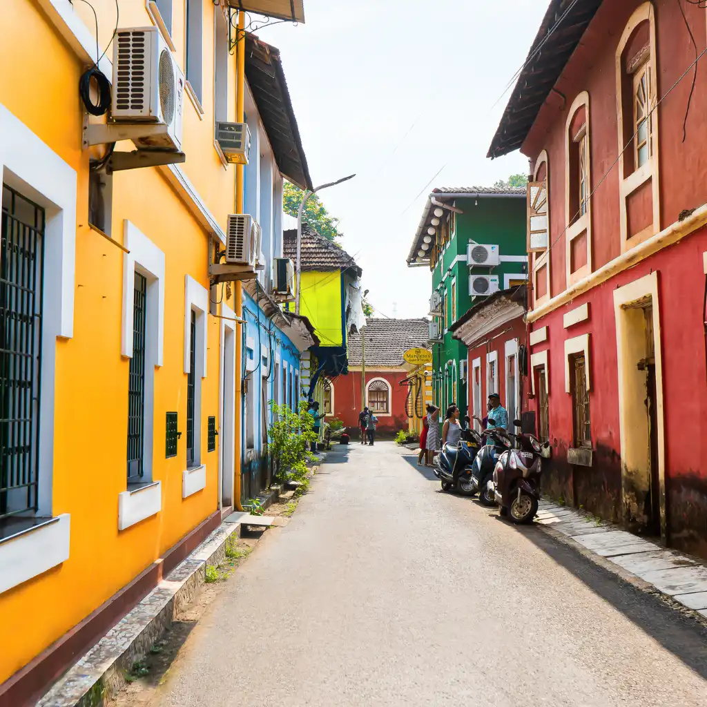 Fontainhas Latin Quarter Goa vibrant narrow street with colorful heritage buildings and scooters