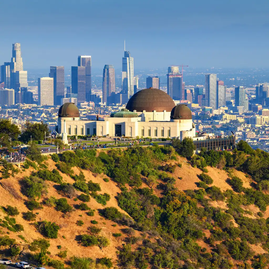 Griffith Observatory Los Angeles with downtown skyline view from hillside