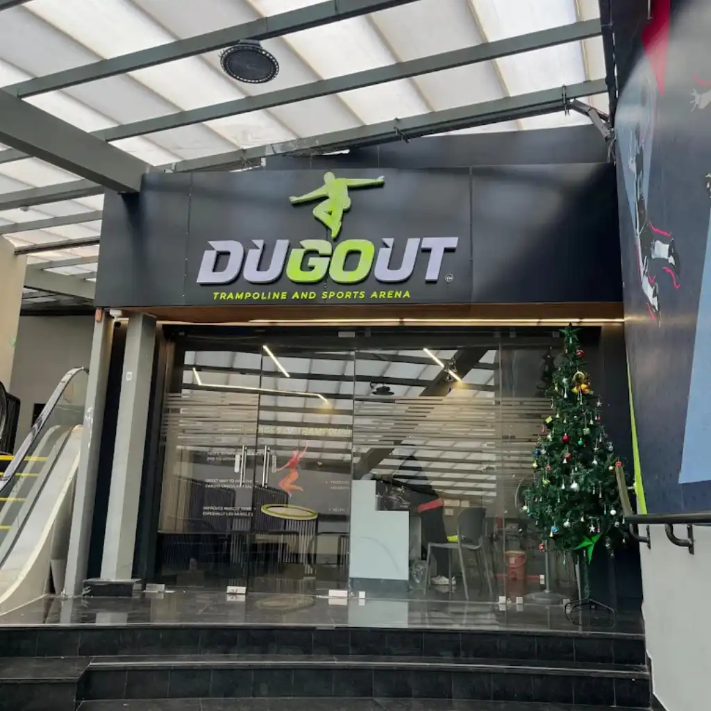 Dugout Trampoline Park and Sports Arena entrance with bold logo above glass doors in Chennai