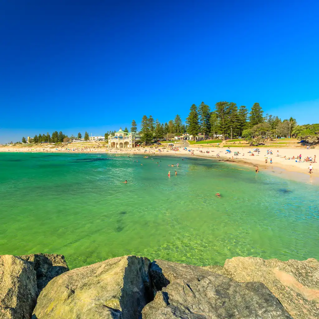 Cottesloe Beach Perth sunny afternoon with clear turquoise waters, swimmers and beachgoers