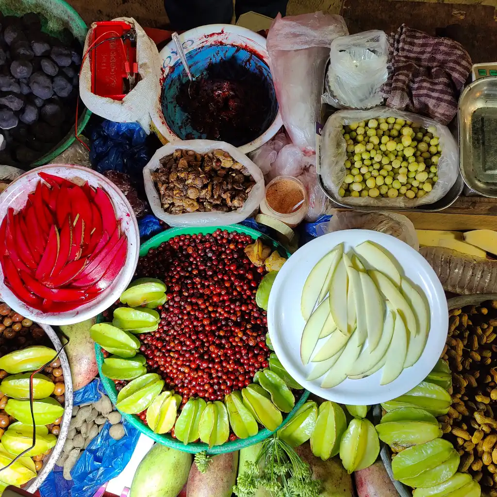 Vibrant fruits spices and snacks at Juhu Beach street food Mumbai
