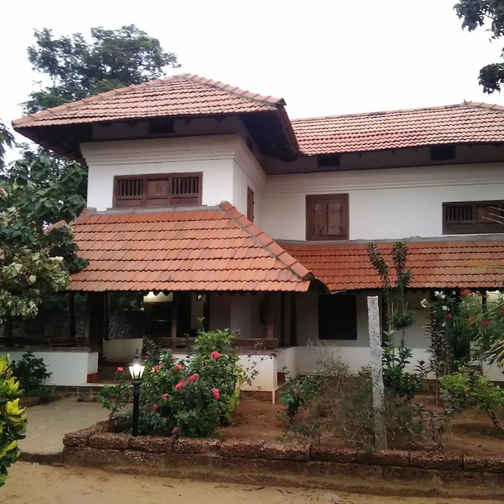 Cholamandal Artists Village Chennai traditional building with red tiled roofs and garden