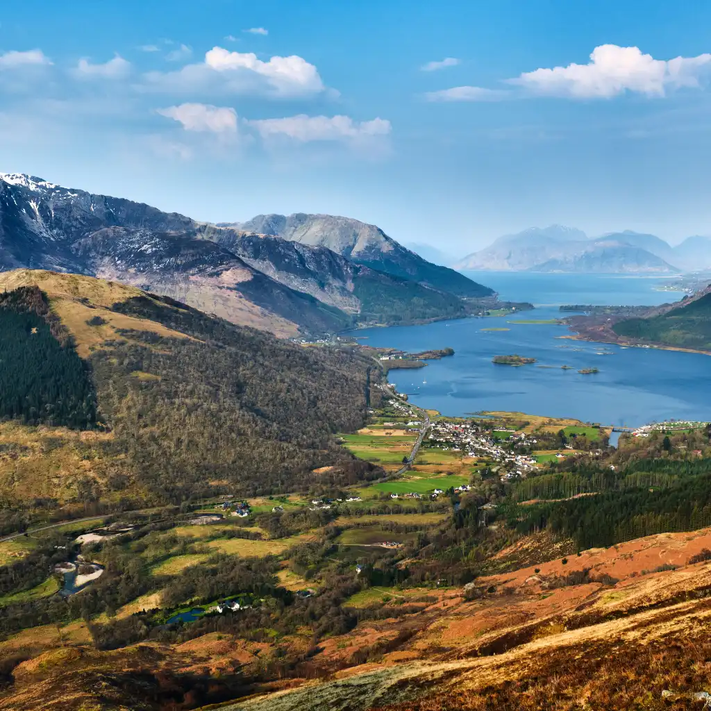 Glencoe Scotland panoramic view of loch mountains and valley village