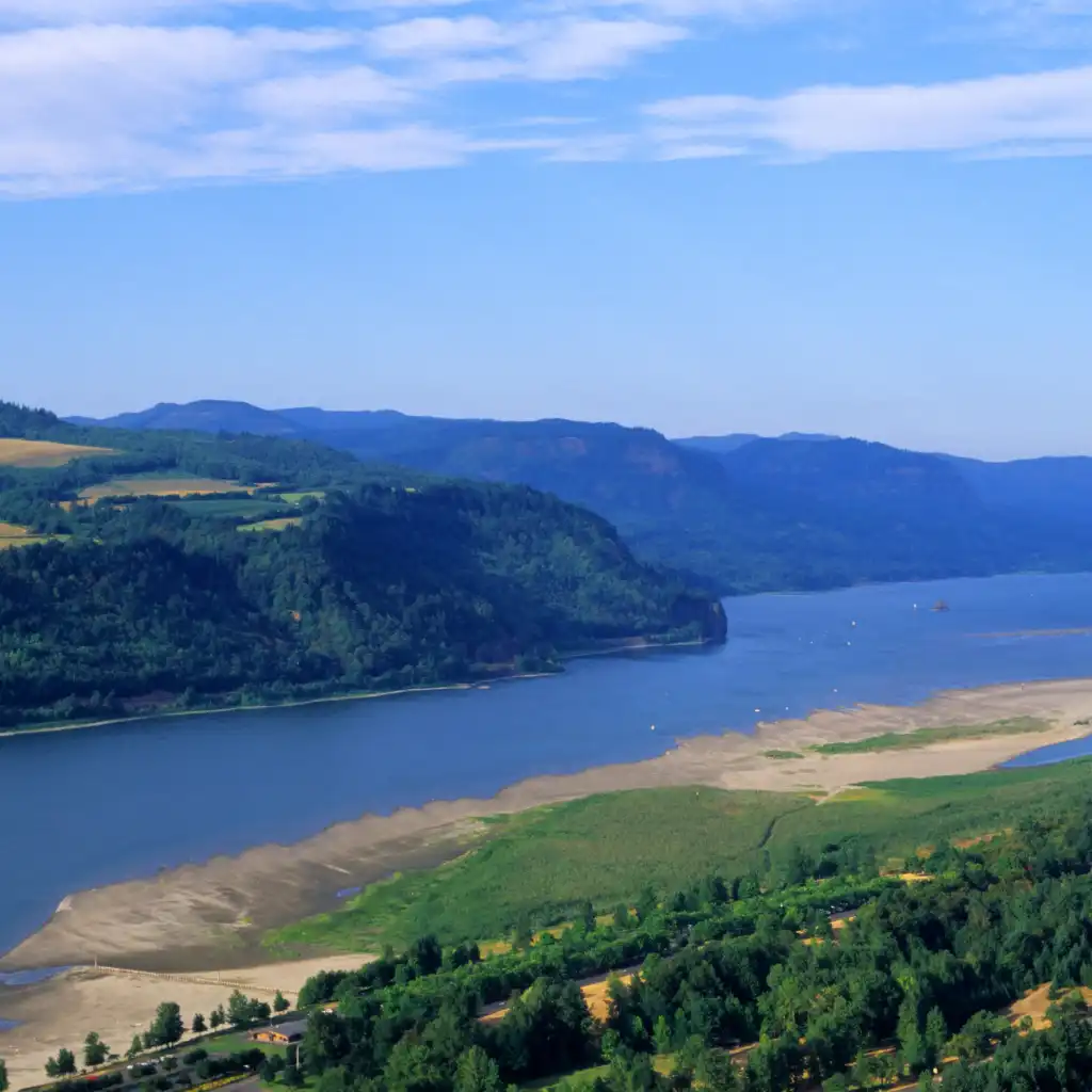 Columbia River Gorge Portland aerial view of wide river, sandy banks and forested hills