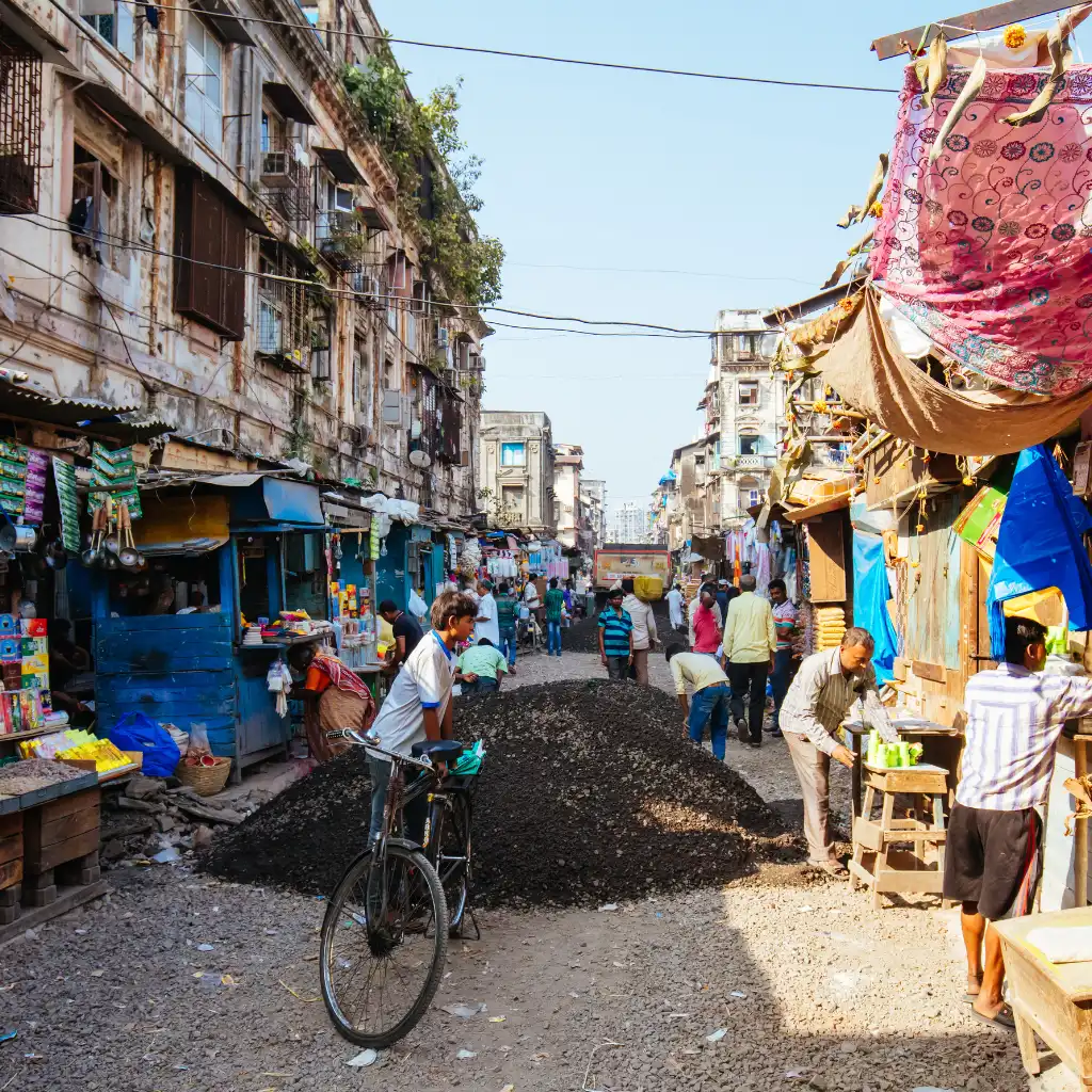 Chor Bazaar Mumbai antique market bustling with shoppers amid colorful stalls and old buildings