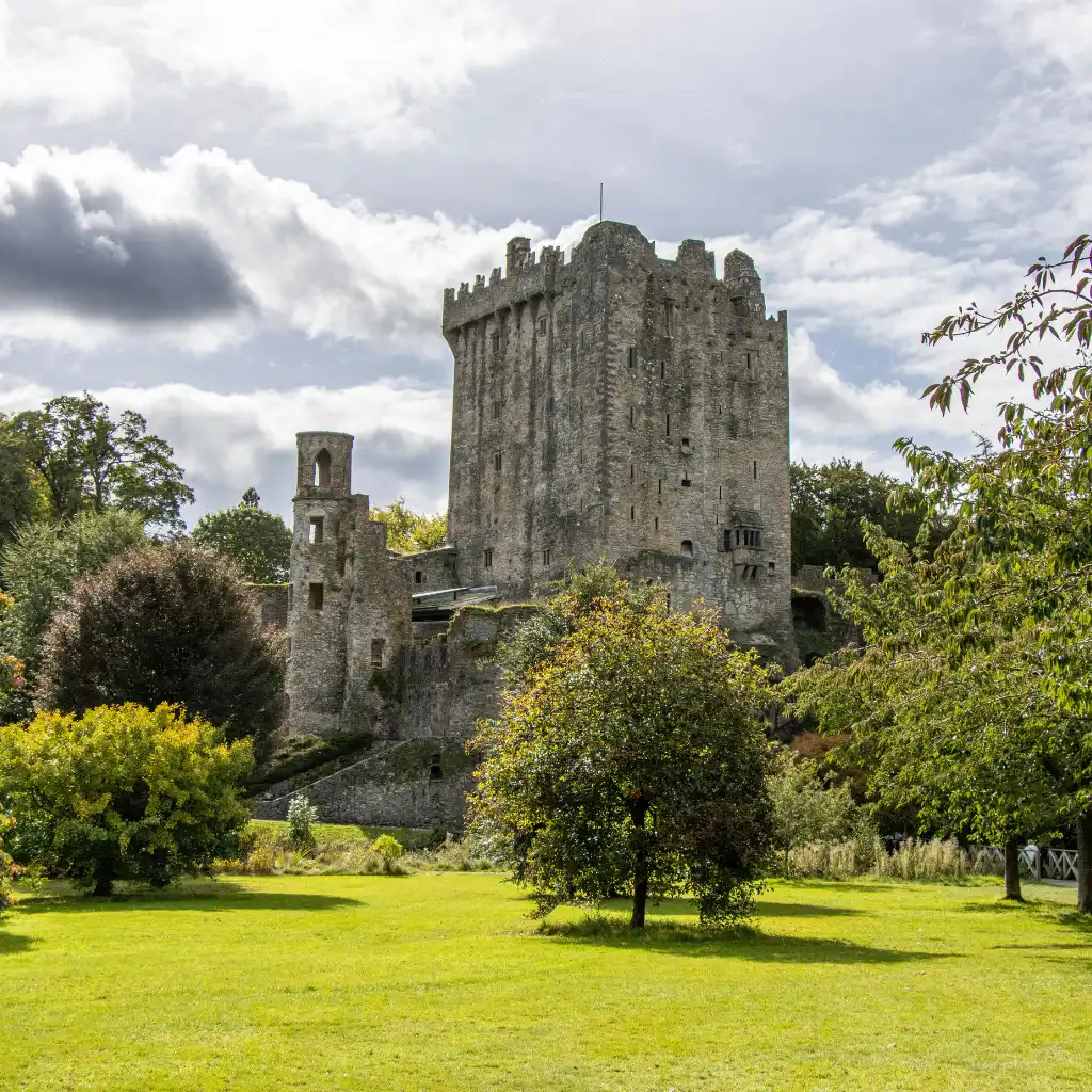 Blarney Castle keep towering over lush lawns and trees, a must-see Irish castle worth the ticket