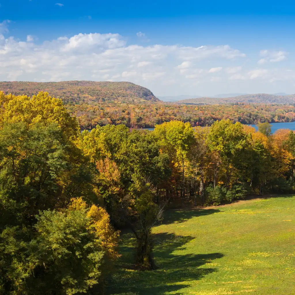 Hudson Valley New York autumn foliage with colorful trees overlooking hills and lake